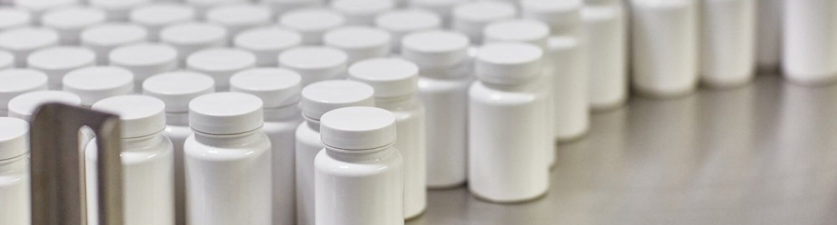 Blank pharmaceutical containers being mass produced